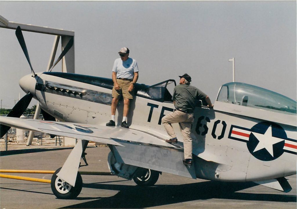 Bill Hane and Rob Horne prepare for flight